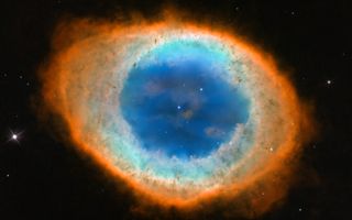 Hubble view of the Ring Nebula with different colors indicating different chemical elements