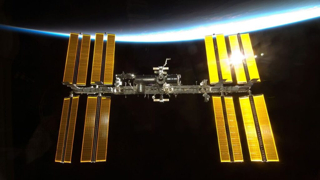 An image of the International Space Station with Earth